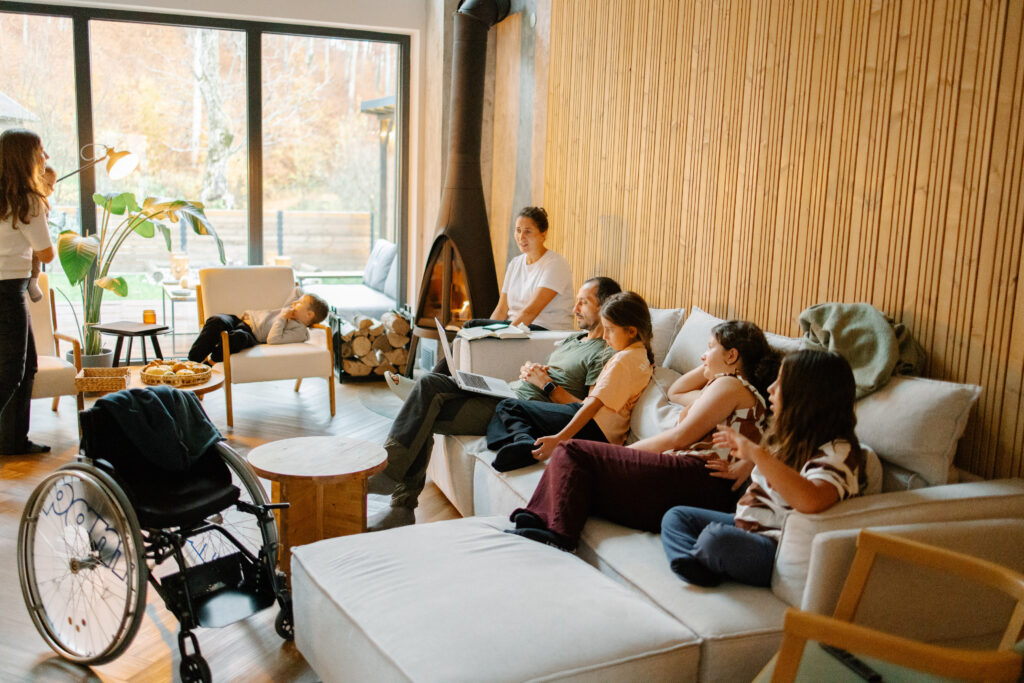 family gathering, relaxing in cozy living room with fireplace