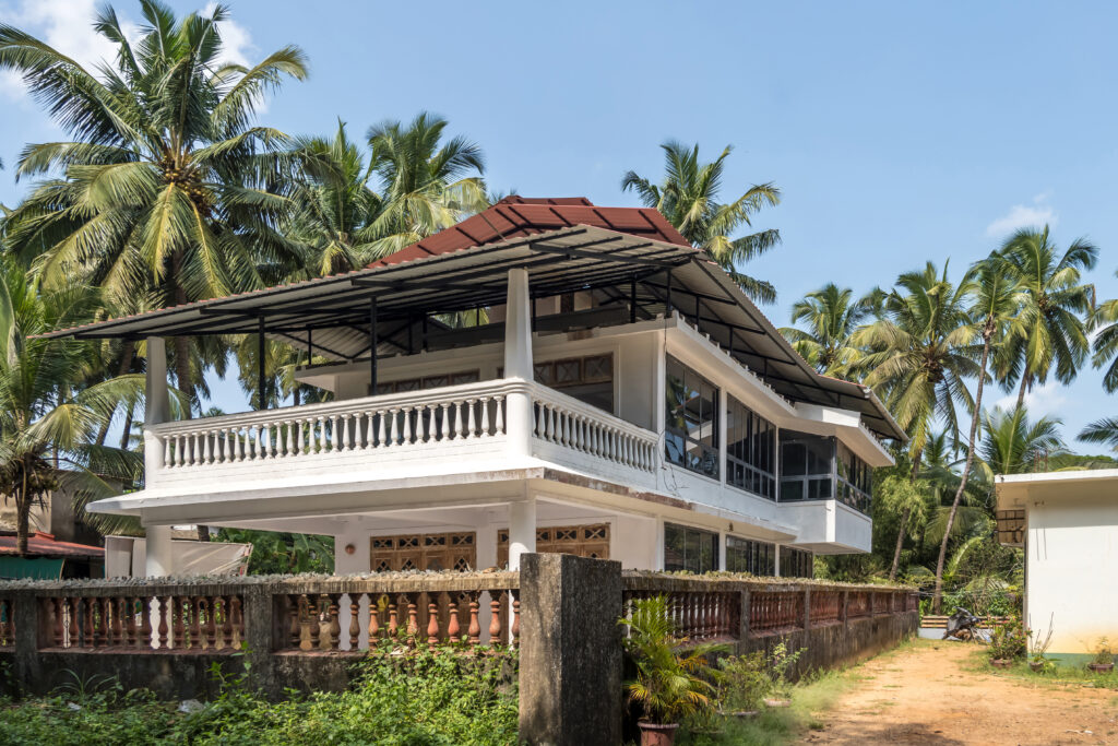 hotel or holiday home in jungle among palm trees on ocean